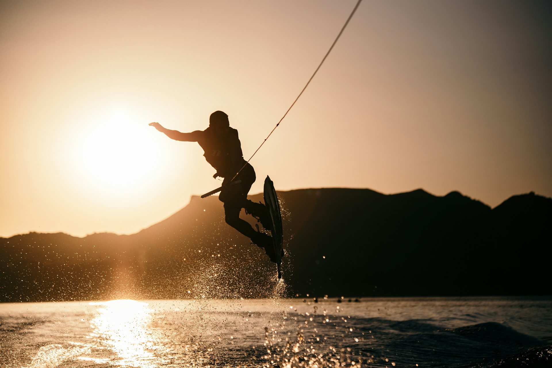 Wakeboarder on Okanagan Lake at sunset