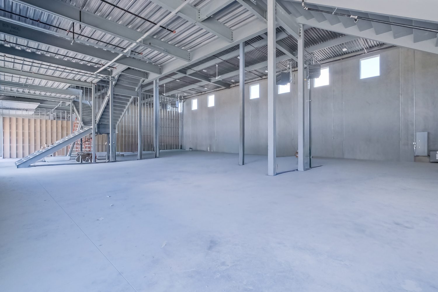 Unit interior with mezzanine framing in progress