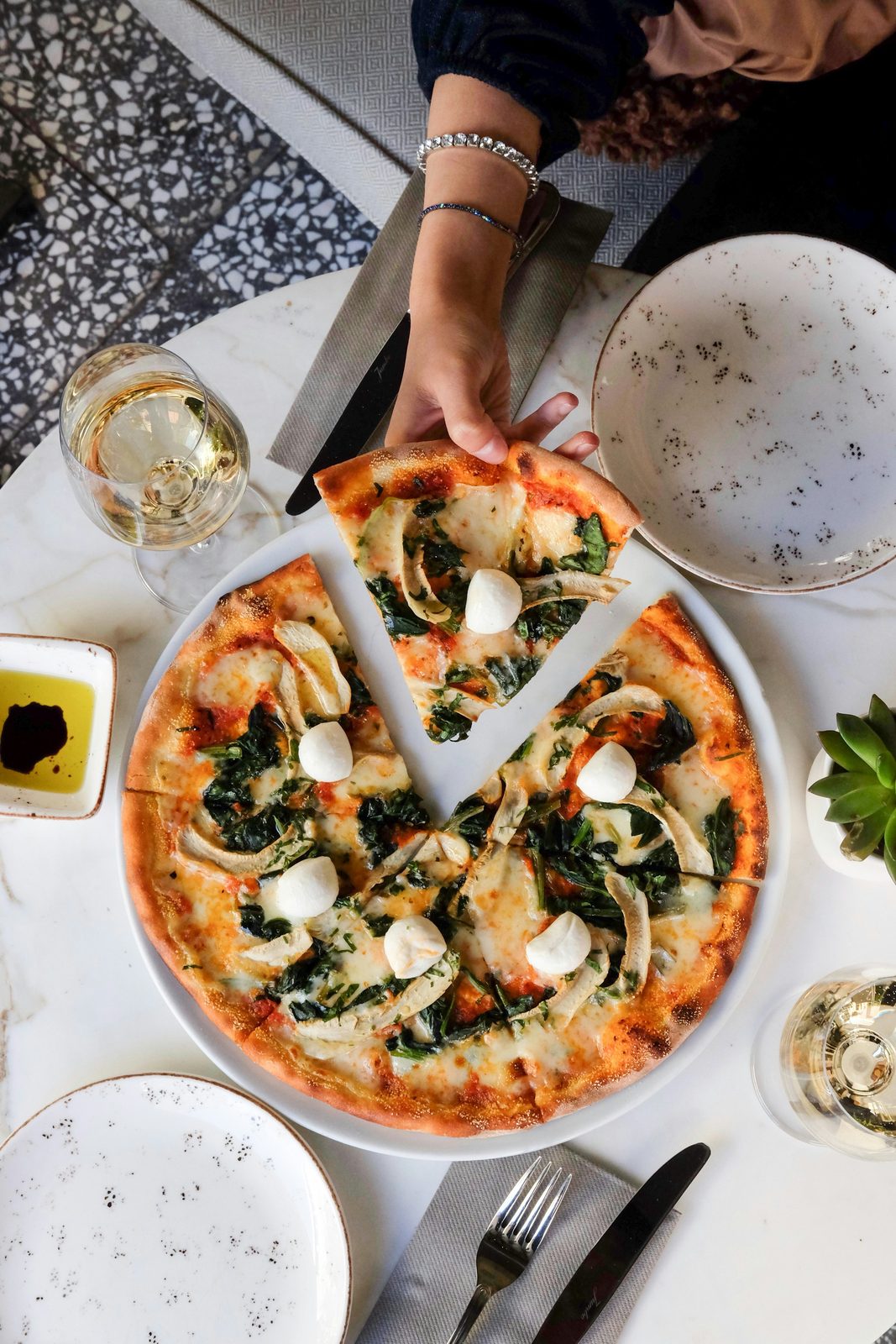Wood-fired pizza and wine at a Kelowna restaurant