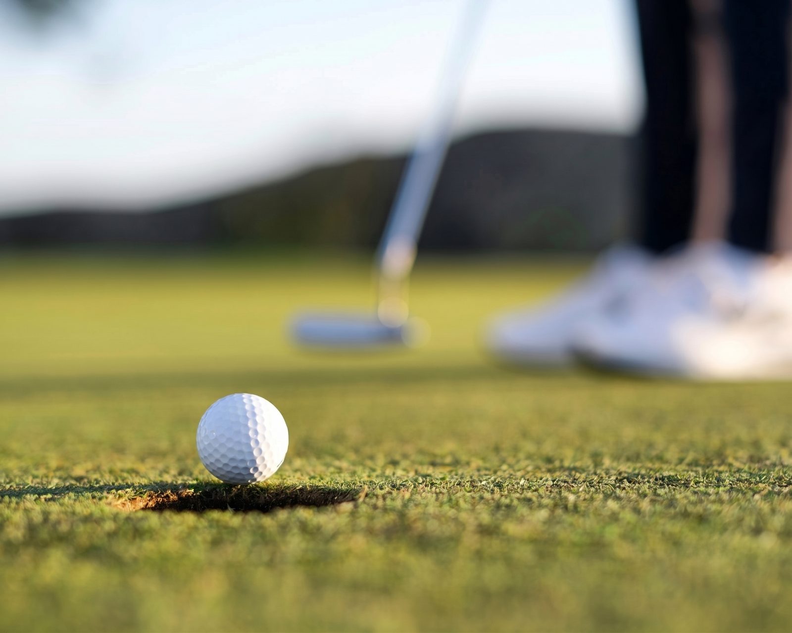 Golf ball and putter on a Kelowna course