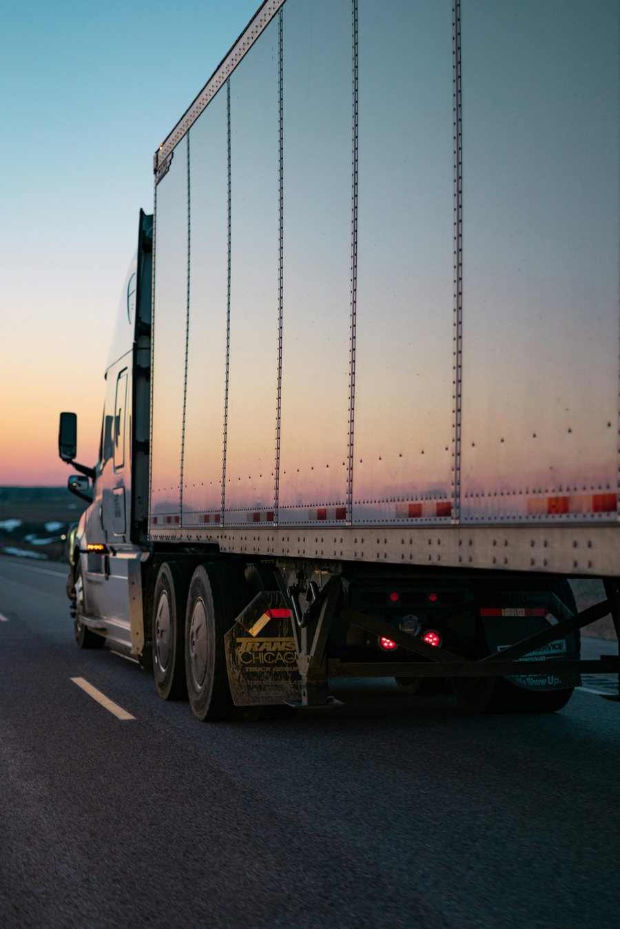 Transport truck on the highway at dusk